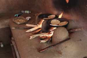 Local villagers preparing traditional Sri Lankan cuisine during a cooking experience on a private tour in Sri Lanka