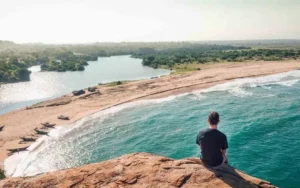 Surfers enjoying the vibrant waves at a picturesque beach on the Surf Sri Lanka East Coast, showcasing the region's stunning coastal beauty and popular surfing spots.