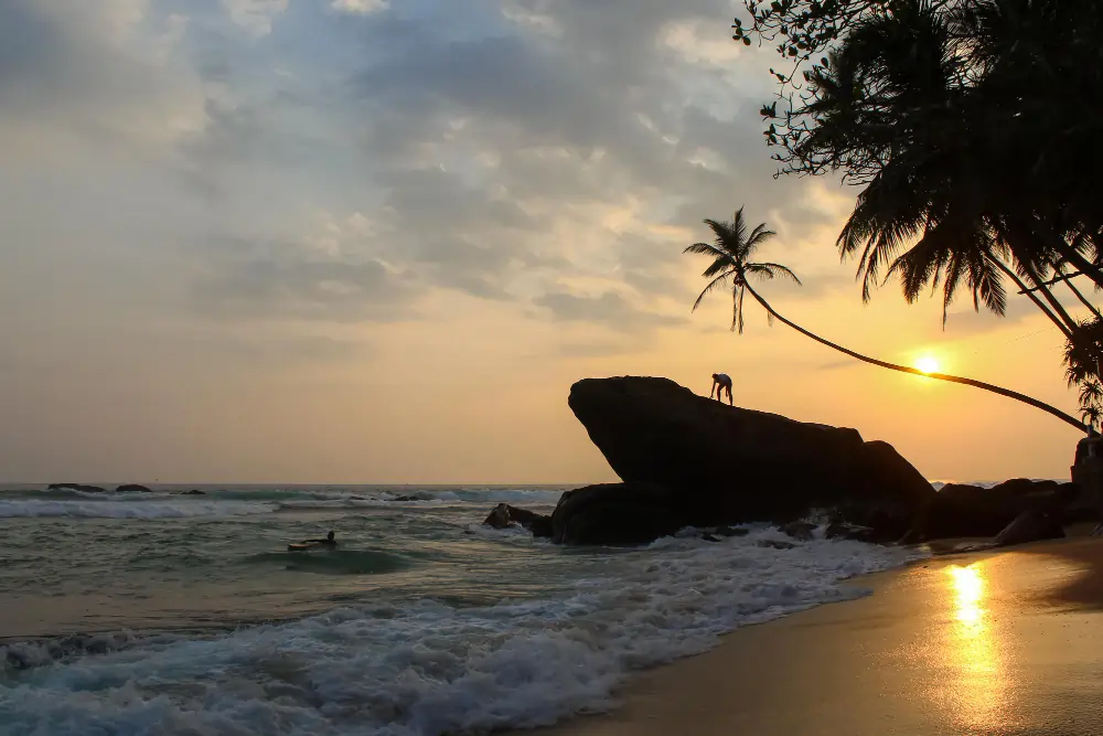 Unawatuna Surf at Sunset: Tranquil Evening Beach Scene in Sri Lanka