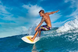 male surfer blue wave sunny day